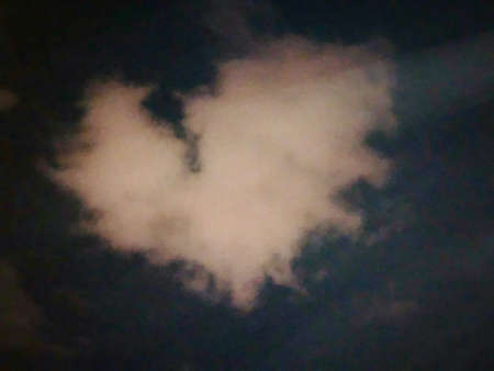 Cloud-shaped heart on a sky dark romanticの写真素材