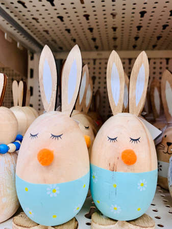 Easter decoration eggs like rabbits in the shop shelf. Easter bunnies. Vintage style pictureの写真素材