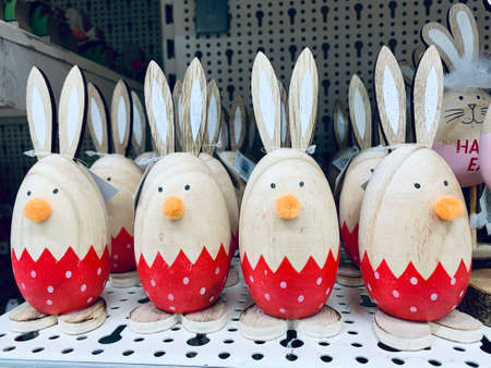 Easter decoration eggs like rabbits in the shop shelf. Easter bunnies. Vintage style pictureの写真素材