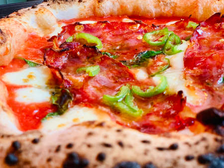Pizza background - macro shot of pizza from stoveの写真素材