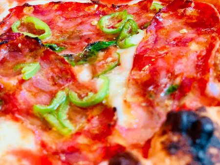Pizza background - macro shot of pizza from stoveの写真素材