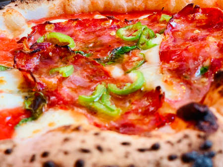 Pizza background - macro shot of pizza from stoveの写真素材