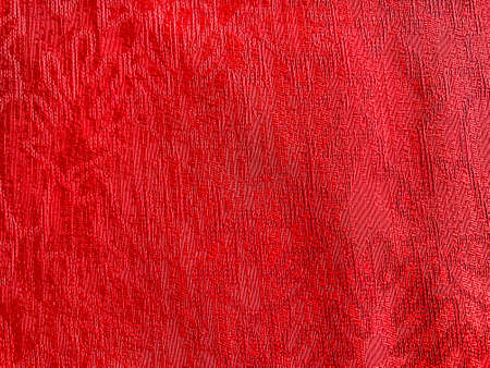 Red fabric as a background texture textileの写真素材