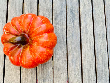 Pumpkins on wooden background top viewの写真素材