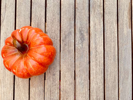 Pumpkins on wooden background top viewの写真素材