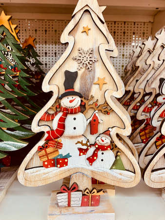 wooden Christmas fir tree located on the shelfの写真素材