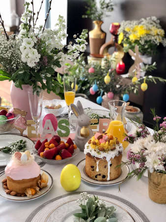 Beautiful Easter table setting with festive decor indoorsの写真素材