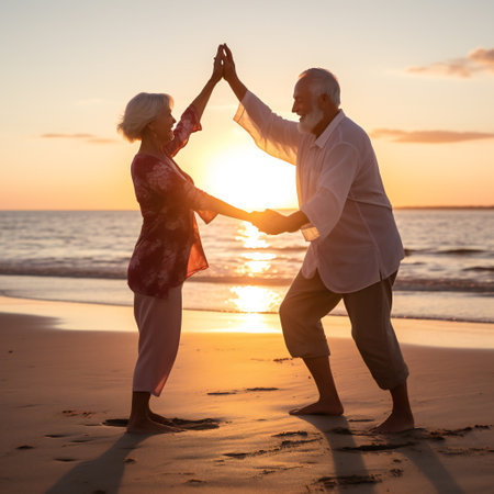 Full length shot of smiling senior couple having fun on the beach. Couple playing on the sea shore holding hands at sunset.の素材