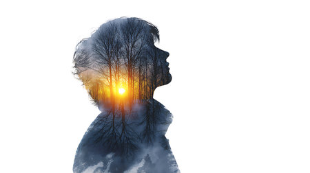 double exposure portrait against the backdrop of a winter forest. A young man in black clothes on white background.の素材