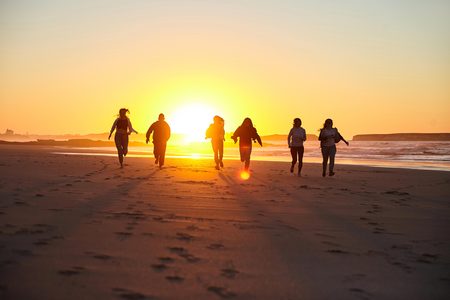 People having fun on a sunny beach.の写真素材