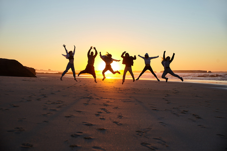 Friends having fun on the beachの写真素材