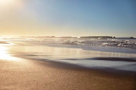 Landscape beach with waves at sunsetの写真素材