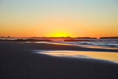 Twilight on the coastal beachの写真素材