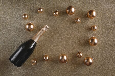 Gold frame from christmas decorations with champagne.の写真素材