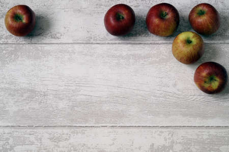 Red apple on wood backgroundsの写真素材