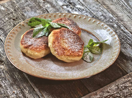 Pancake under powdered by sugar and spearmintの写真素材