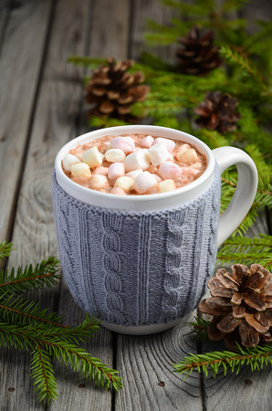 Hot chocolate with marshmallows on the rustic wooden tableの写真素材