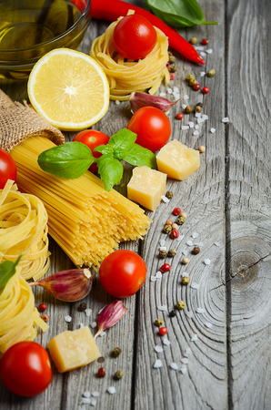 Pasta, vegetables, herbs and spices for Italian foodの写真素材