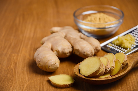 Ginger root on wooden table.の写真素材