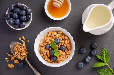 Homemade granola with blueberries on black background, top viewの写真素材
