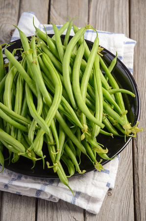 French beans on wooden backgroundの写真素材