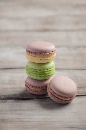 Colorful French macaroons on wooden background, selective focus, copy spaceの写真素材