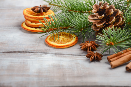 Christmas background with fir branches, spices and cones, selective focus, copy space.の写真素材