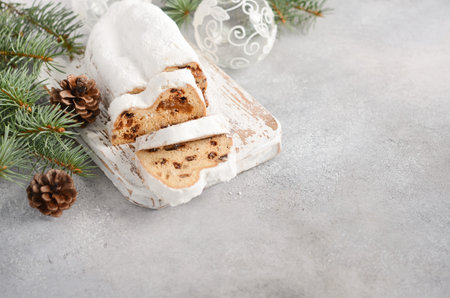 Christmas Stollen. Traditional German, European Festive Dessert. Holiday Concept Decorated with Fir Branches.の写真素材