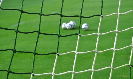 soccer goal net pattern - grass football background の写真素材