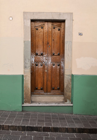 Front of an old mexican house - Colonial style door and window - San Miguel de Allende Mexicoの写真素材