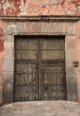 Old rusty Mexican colonial door in Queretaro Mexicoの写真素材