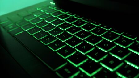 Laptop Gamming Keyboard with green lights.の写真素材