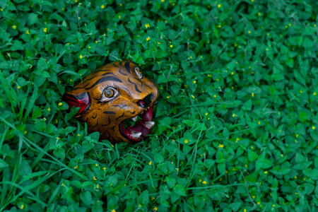 Jaguar Head Carved in wood Mexican crafts on natural background.の写真素材