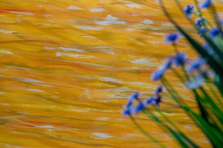 Yellow Color Paint Strokes on Canvas Surface, defocused Flowers.の写真素材