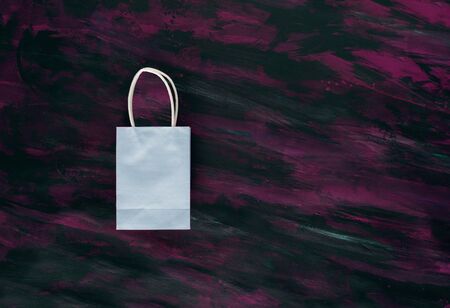 Light Blue Small Shopping Bag on Painted Canvas.の写真素材