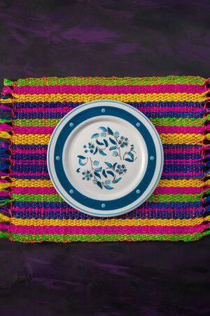 Rustic Plate Decorated on Mexican Woven Tablecloth.の写真素材