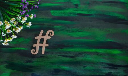 Hashtag Tagging Symbol made with Wooden letter on Hand painted Canvas.の写真素材