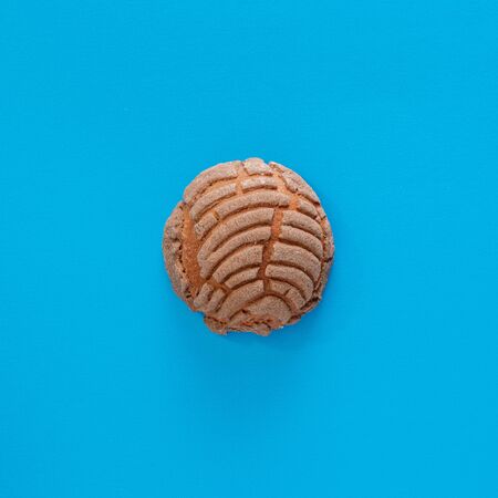 Concha Bread, Mexican Sweet Scone on Blue Surface.の写真素材