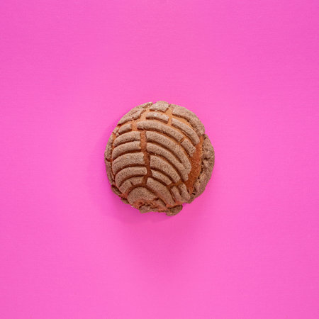 Concha Bread, Mexican Sweet Scone on Pink Surface.