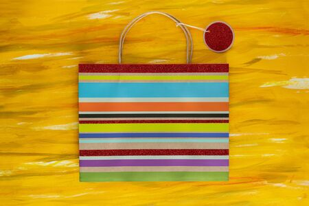 Striped Shopping Bag and label on Painted Canvas.の写真素材