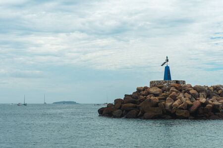 Breakwater with Tidal Flag in Punta de Mita Mexican Beachの写真素材