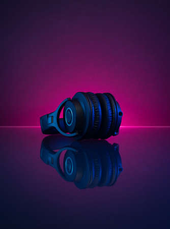 Wireless Gamer Headphones Dark Background and Neon Light.の写真素材