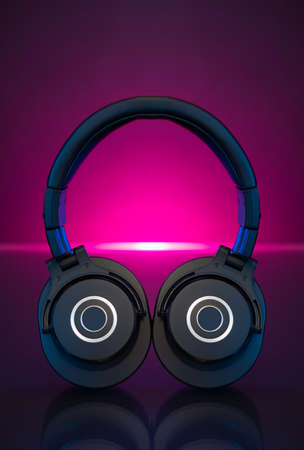 Gamer Headphones Dark Background and colorful pink Light.の写真素材