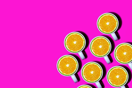 A lot of Orange slices on a cup illustrating orange juice. Health concept image.