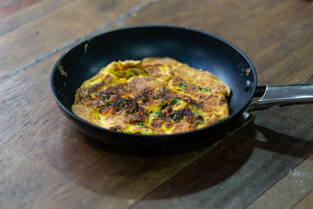 Hot omelet in skillet ready to eat. healthy foodの写真素材