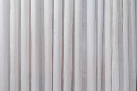 A new clean white curtain. Small fabric texture.の写真素材