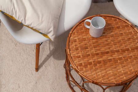 Very cozy living room and a mug on the table.の写真素材