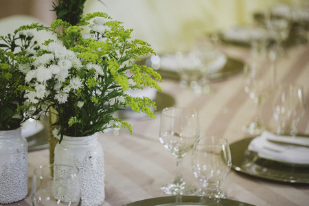 Table decorated for wedding event. Colors golden and white.の写真素材