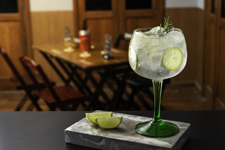 Gin tonic cocktail is on the bar. Space for text. Photo for the menu.の写真素材