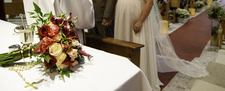 Bouquet of flowers on altar during religious ceremony.の写真素材